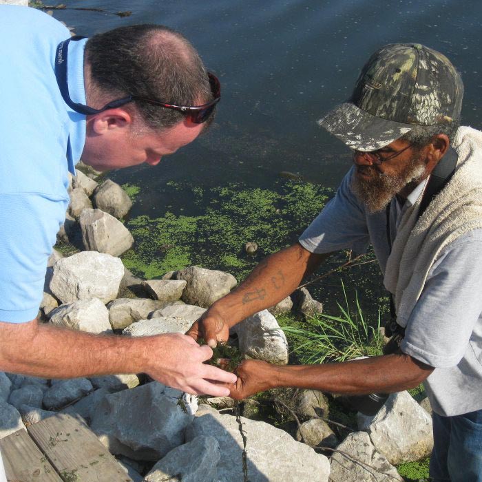 Local fisherman showing vegetation to Army Corps