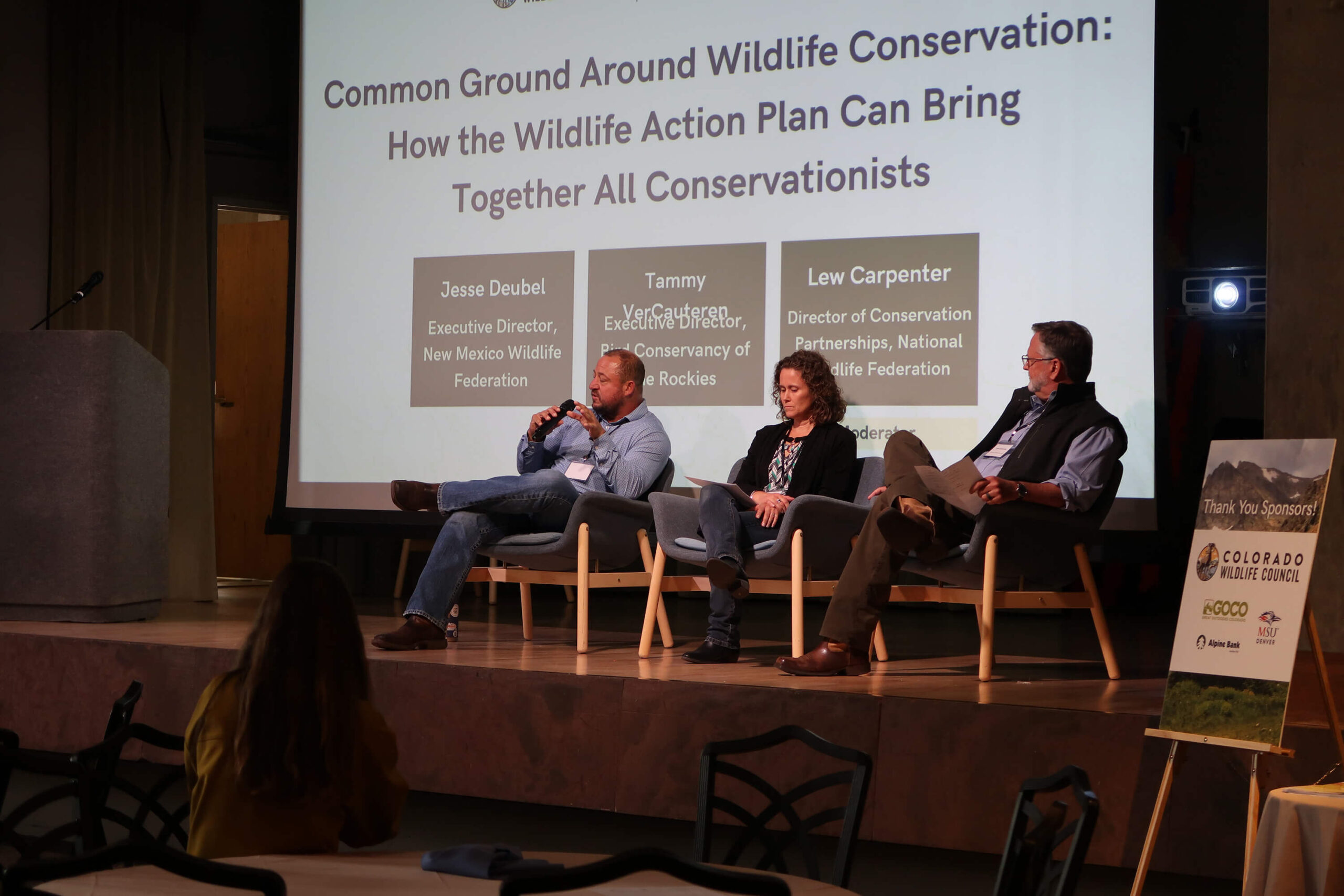 Three speakers at Colorado Wildlife Federation Wildlife Summit stage.